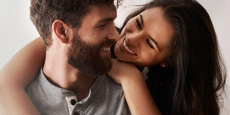 A man and woman smiling lovingly at each other