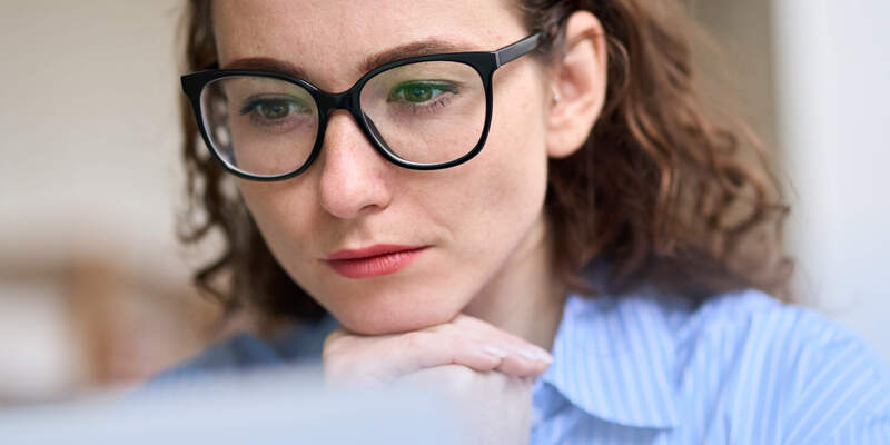 A white woman reading about  the coil IUD