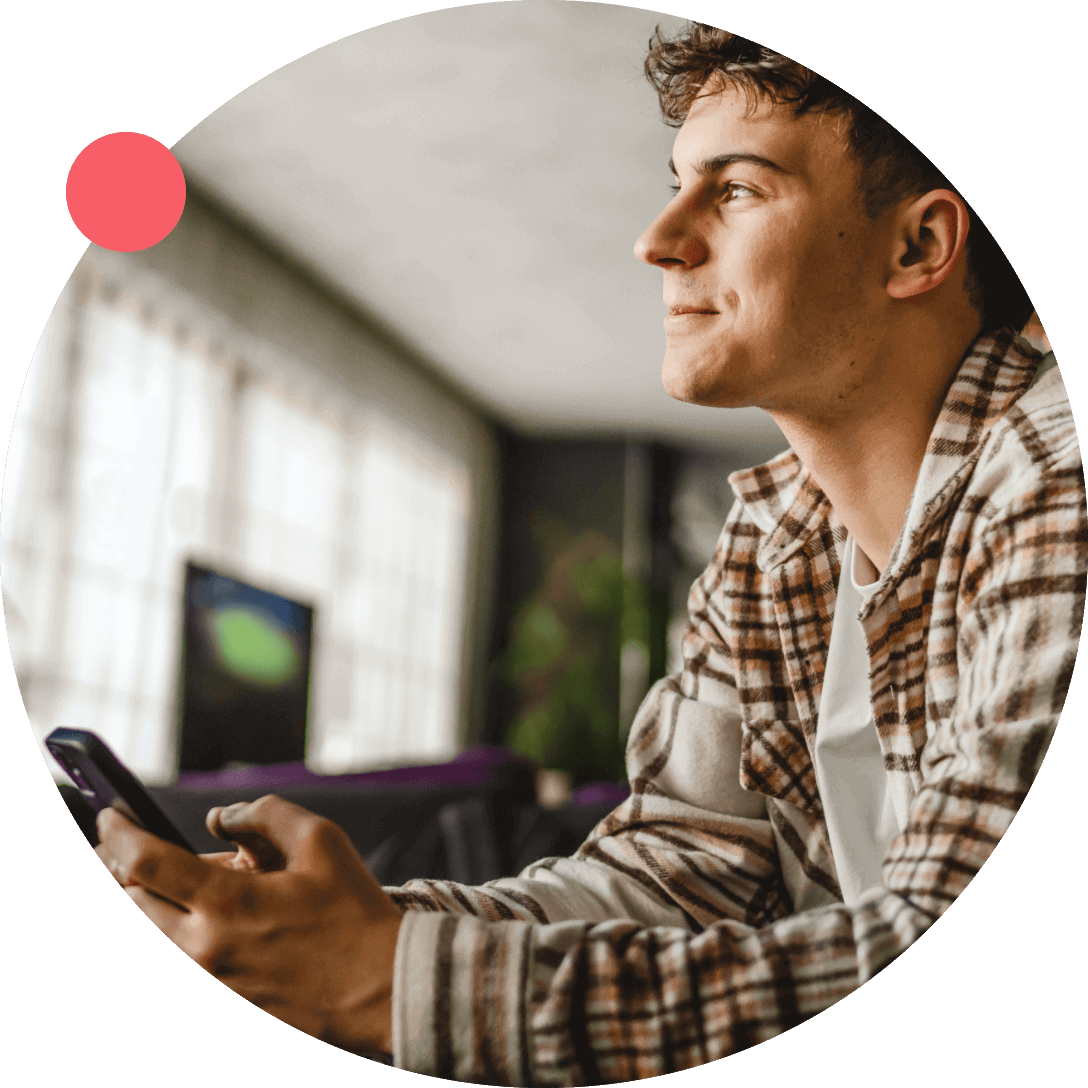 Young Irish man scheduling his ADHD assessment with HealthHero via smartphone